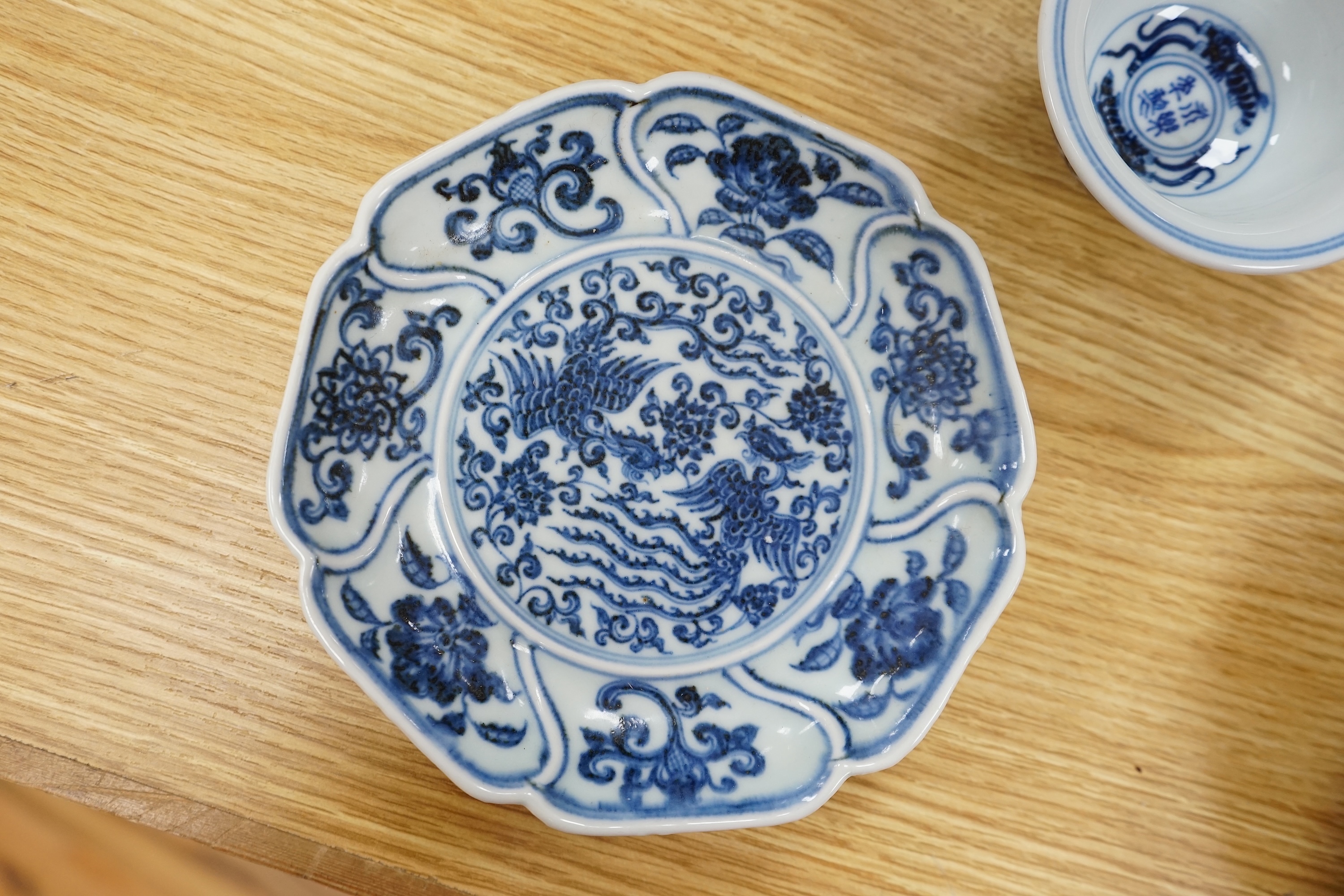 A Chinese copper red glazed dish, a blue and white bowl and a similar dish, bowl 22.5cm diameter. Condition - good